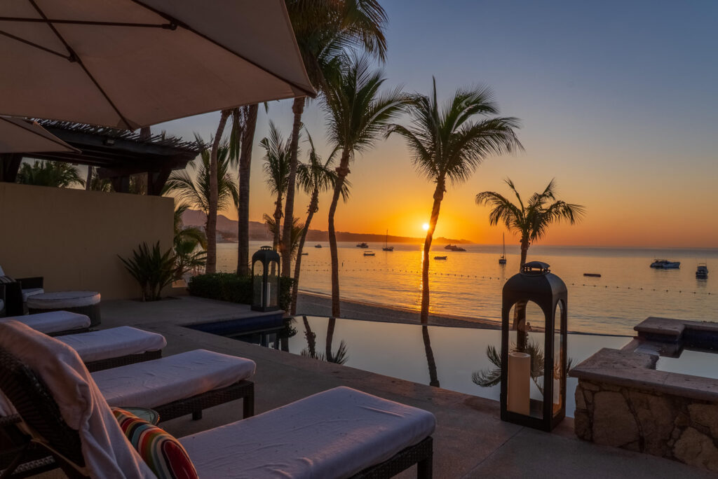 Cabo Luxury Las Tunas The Nacuii Residence is a refined luxury home crafted to exceed the expectations of even the most discerning buyer. Nestled on a generous and private 3,000 m² lot (0.73 acres), it's just a short, effortless stroll to the untouched, sandy shores of Las Tunas — perfect for enjoying the serene coastal landscape and dramatic sunsets. The home offers a thoughtful layout with 3 spacious bedrooms, a separate studio, a cozy TV lounge, and 6 full bathrooms, including two principal suites, a guest room, a detached studio, and a dedicated media or family room. Expansive sliding glass doors invite natural light throughout the interiors while showcasing tranquil garden for sale