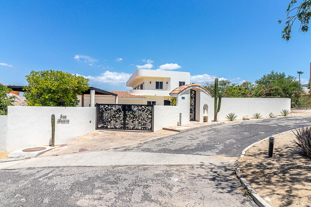 Cabo Luxury Las Tunas The Nacuii Residence is a refined luxury home crafted to exceed the expectations of even the most discerning buyer. Nestled on a generous and private 3,000 m² lot (0.73 acres), it's just a short, effortless stroll to the untouched, sandy shores of Las Tunas — perfect for enjoying the serene coastal landscape and dramatic sunsets. The home offers a thoughtful layout with 3 spacious bedrooms, a separate studio, a cozy TV lounge, and 6 full bathrooms, including two principal suites, a guest room, a detached studio, and a dedicated media or family room. Expansive sliding glass doors invite natural light throughout the interiors while showcasing tranquil garden for sale