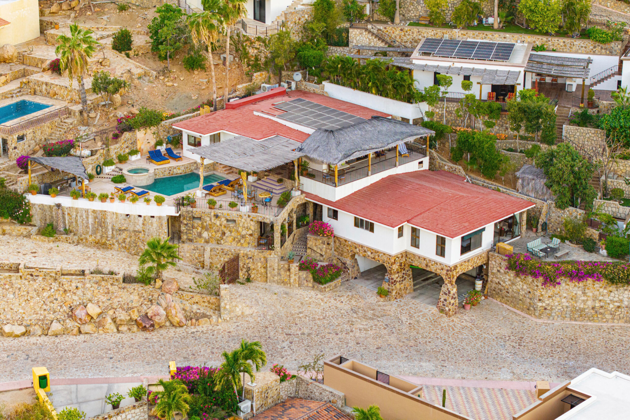 Cabo Luxury Rancholasmargaritas Casa Playa Escondida - Oceanfront Luxury in Baja California SurPerched dramatically on the rocks above the Pacific Ocean, Casa Playa Escondida is a rare oceanfront retreat set along a secluded, pristine stretch of beach. Located within the exclusive off-grid gated community of Rancho Las Margaritas, this one-of-a-kind property offers privacy, tranquility, and breathtaking natural beauty--just a 20-minute drive to the dining and shopping of Cabo San Lucas, 40 minutes from Los Cabos International Airport, and approximately 30 minutes south of Cerritos and Todos Santos.The residence features three spacious ensuite bedrooms, each privately situated yet connected by terraces, pathways, and shared gathering spaces. A dedicated media room offers flexibility as a fourth bedroom or additional guest suite.Expansive terraces and multiple lounging areas provide a variety of vantage points to take in the surrounding landscape, from the rugged coastline to the endless Pacific horizon.The gourmet kitchen is equipped with high-end appliances and designed for both functionality and style. A warm and inviting living and dining area, anchored by a striking fireplace, creates the perfect space for entertaining or relaxing with family and friends. The home is offered fully furnished with includes modern off-grid conveniences such as solar power.Outdoor living is equally exceptional, featuring a swimming pool, firepit, grilling area, and multiple seating spaces--ideal for enjoying the serene coastal setting for sale