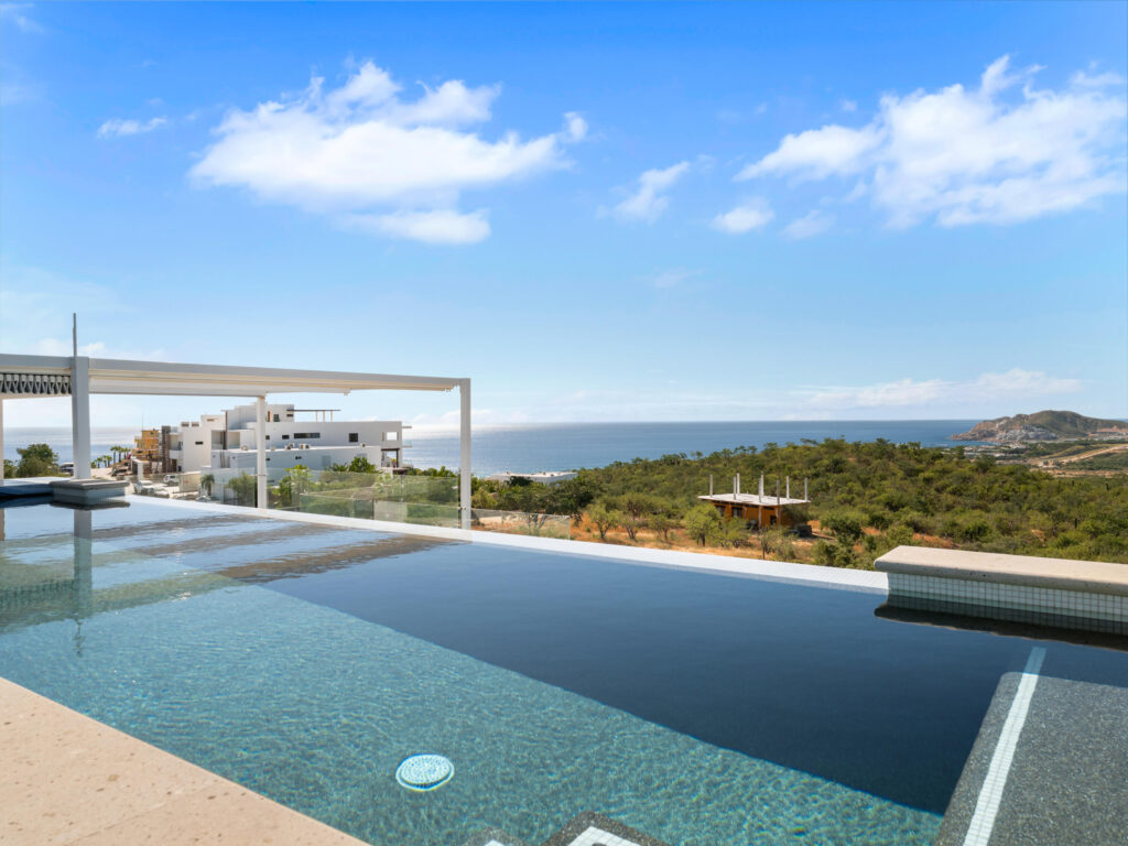 Cabo Luxury Section 4- Las Canadas Discover refined indoor-outdoor living at Cañada 9, set within Querencia, San Jose del Cabo's premier private golf community. Soaring beamed ceilings, walls of pocket glass, and luminous marble floors define an open great room that flows effortlessly to the terrace, infinity-edge pool, and stone-clad water feature -- all framed by panoramic Sea of Cortez and mountain – El Tule, San Jose Corridor, BS
