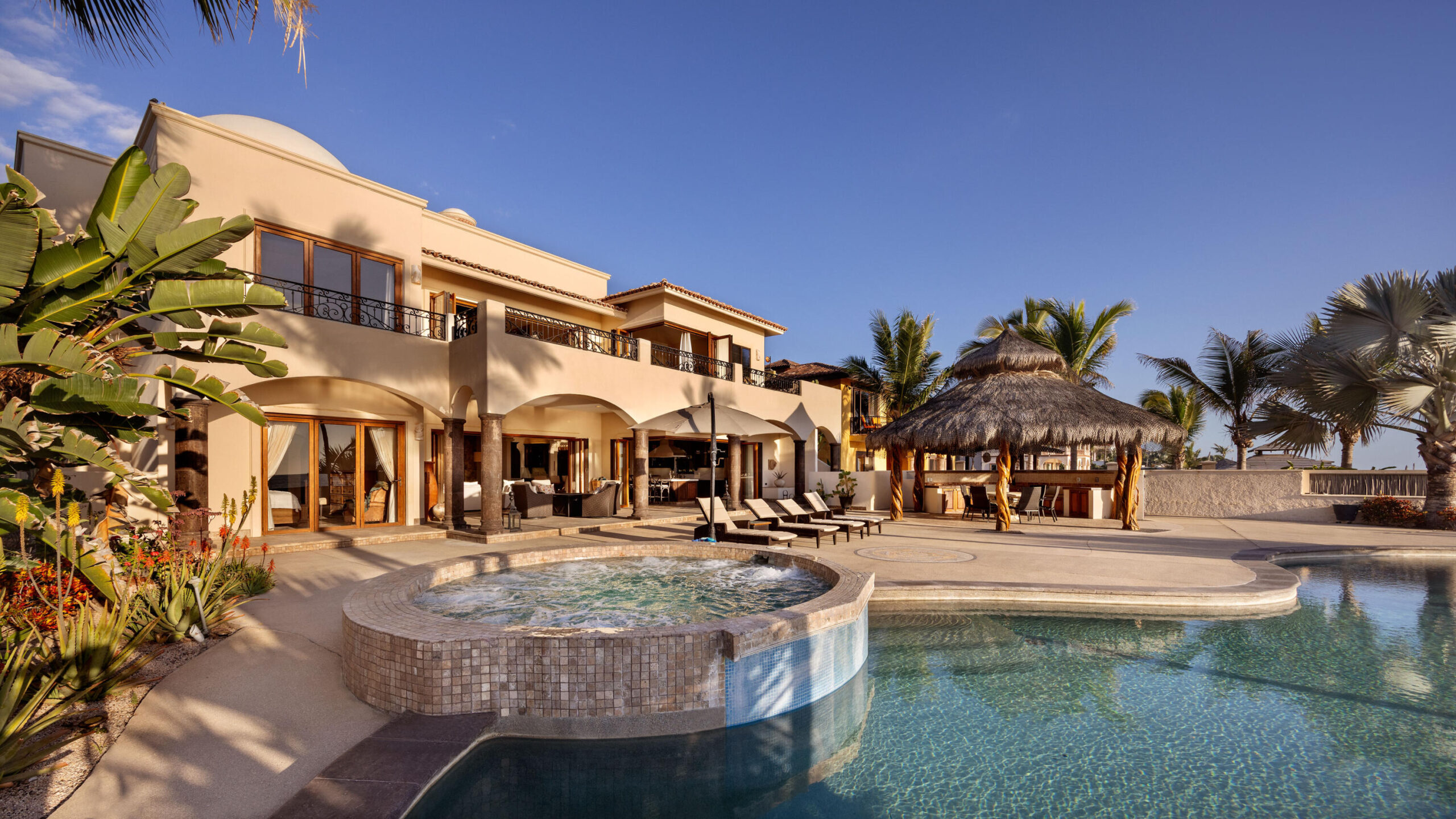 Cabo Luxury Park Hyatt Villa Mariposa is a stunning three-bedroom oceanfront retreat designed for those seeking privacy, tranquility, and timeless Baja elegance. Showcasing classic Hacienda-style architecture, the villa features rich wood furnishings, warm finishes, and tasteful pops of color that create an inviting and sophisticated atmosphere throughout.Wake up to the soothing sound of the waves and spend your days enjoying the private pool and hot tub overlooking the Sea of Cortez. The expansive terrace provides the perfect setting for al fresco dining, sunset cocktails, or simply relaxing while watching whales pass by during the season.The gourmet kitchen is equipped with high-end appliances and complemented by a charming breakfast nook. See more... The open-concept living and dining areas seamlessly connect to the spacious terrace, maximizing indoor-outdoor living and capturing breathtaking ocean for sale