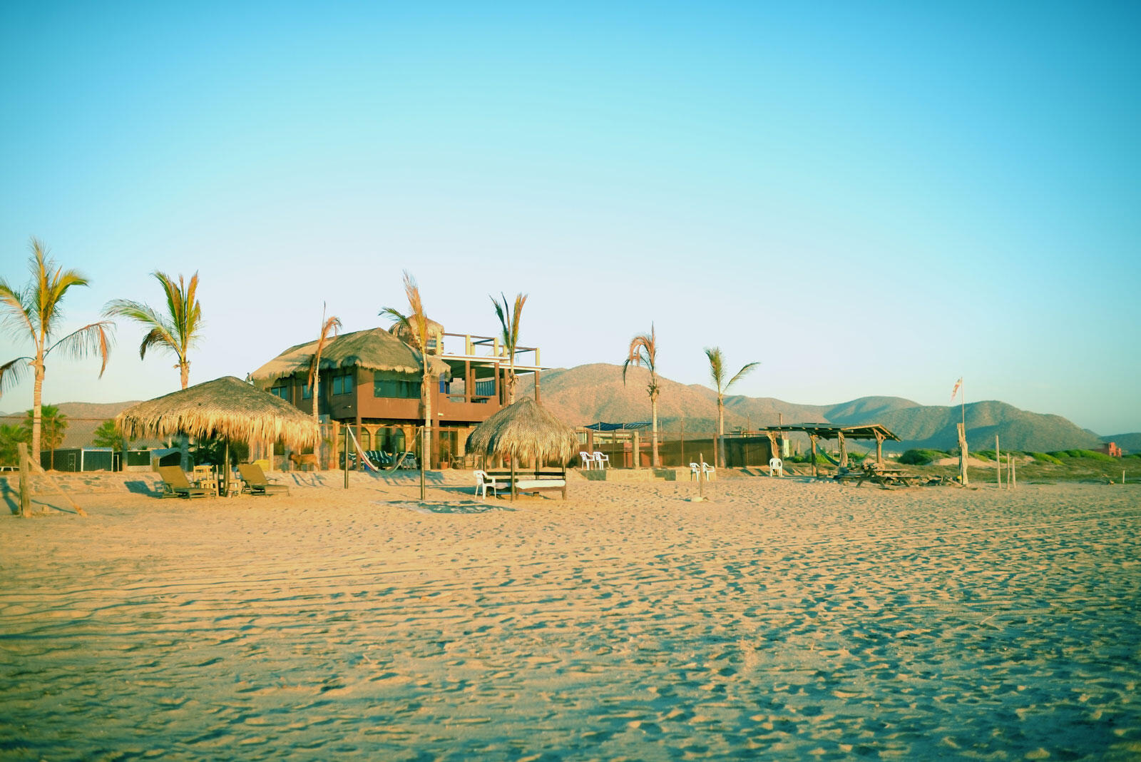 Cabo Luxury Las Tunas The Nacuii Residence is a refined luxury home crafted to exceed the expectations of even the most discerning buyer. Nestled on a generous and private 3,000 m² lot (0.73 acres), it's just a short, effortless stroll to the untouched, sandy shores of Las Tunas — perfect for enjoying the serene coastal landscape and dramatic sunsets. The home offers a thoughtful layout with 3 spacious bedrooms, a separate studio, a cozy TV lounge, and 6 full bathrooms, including two principal suites, a guest room, a detached studio, and a dedicated media or family room. Expansive sliding glass doors invite natural light throughout the interiors while showcasing tranquil garden for sale
